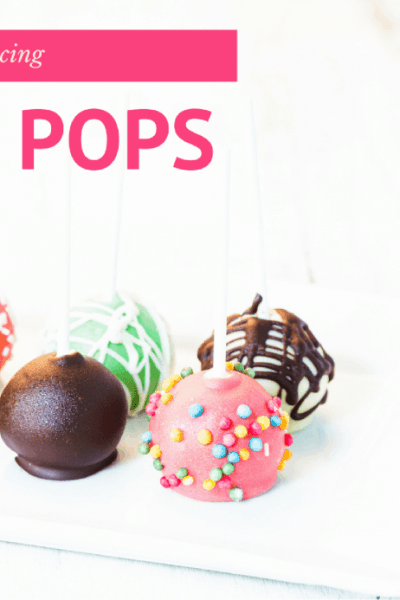 Colorful cake pops with sprinkles on a white serving platter